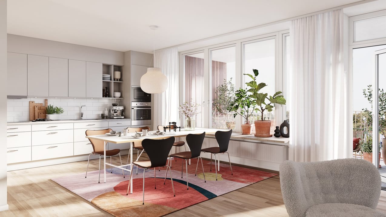 Vy över vardagsrum och kök med fin inredning